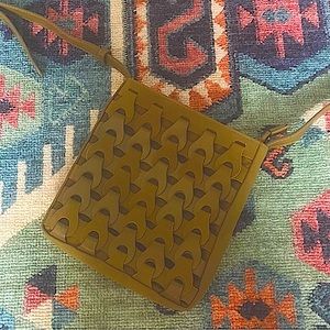 The brand of this bag is universal thread and a army green color